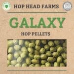 A labeled package of Galaxy hop pellets from Hop Head Farms. The pellets are visible through a transparent window on the packaging.